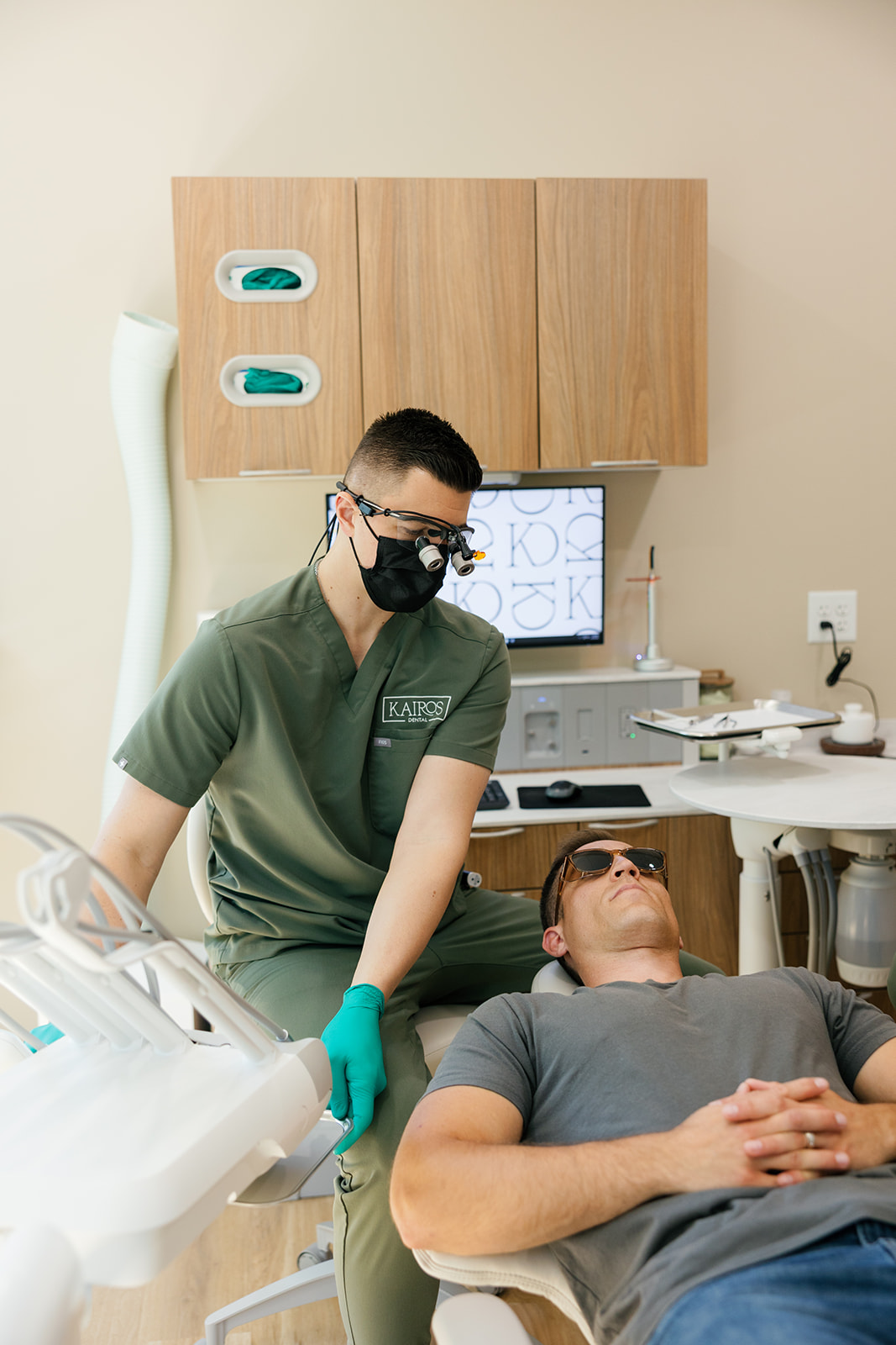 Dr. Tyler Koupal preparing for a dental treatment at Kairos Holistic Dental